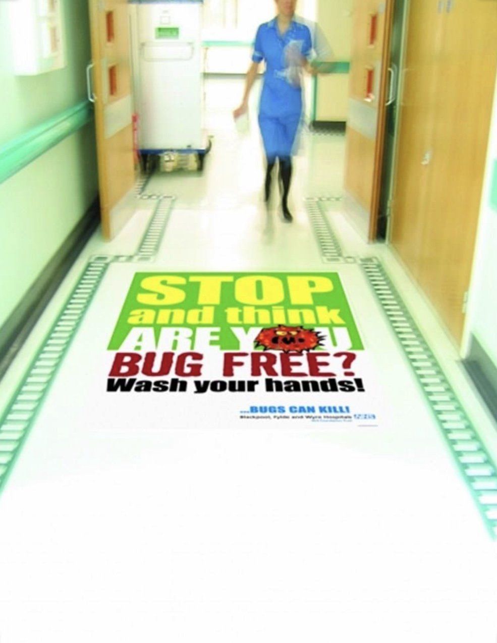 Wide format floor graphic in a hospital corridor